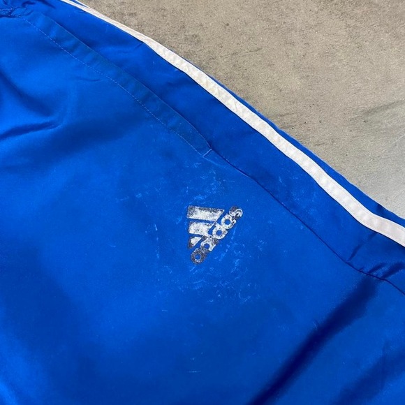 Blue Adidas track pants with white stripes - Picture 2 of 8